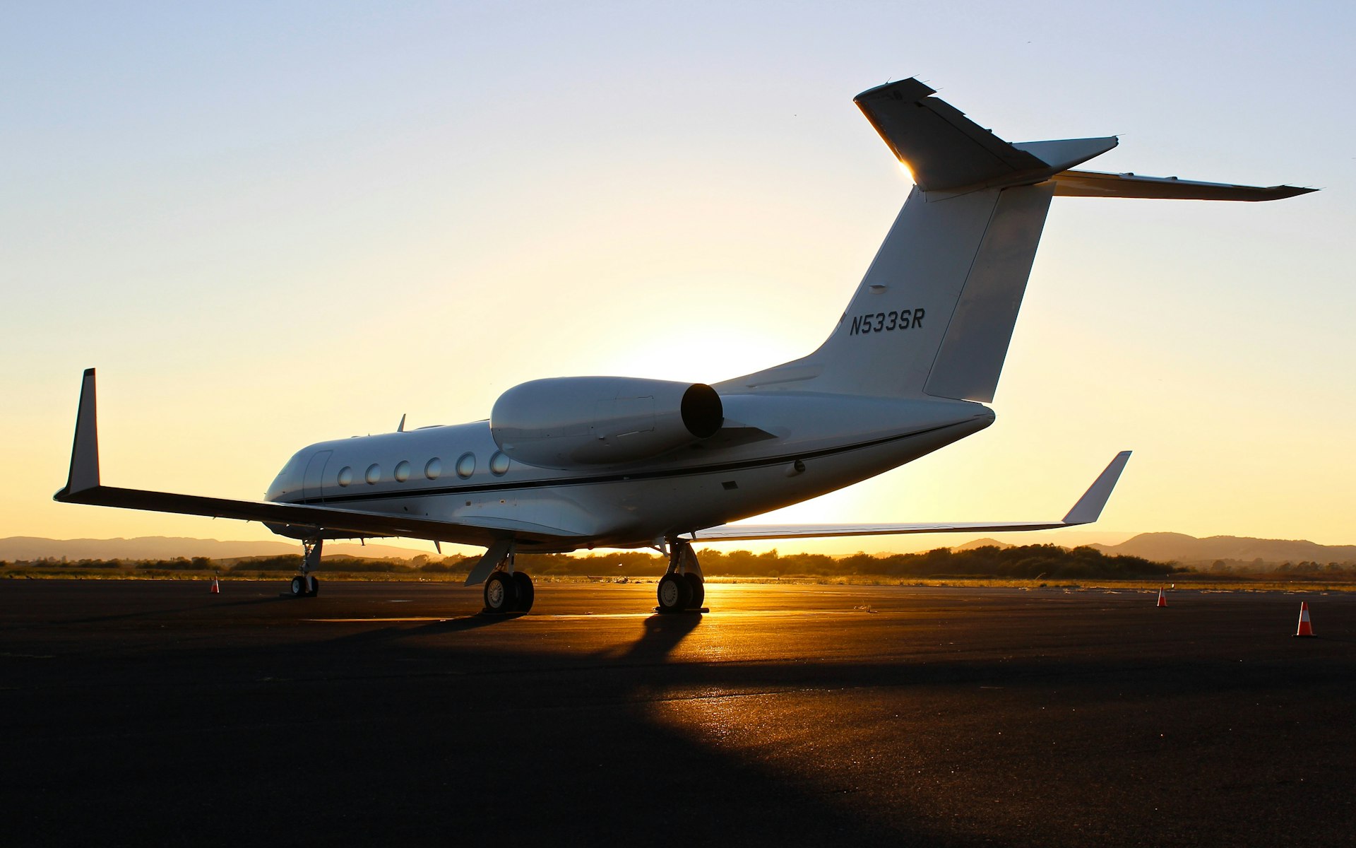 A private jet on the apron at dusk